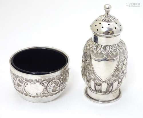 A Victorian silver embossed pepper pot hallmarked 1888