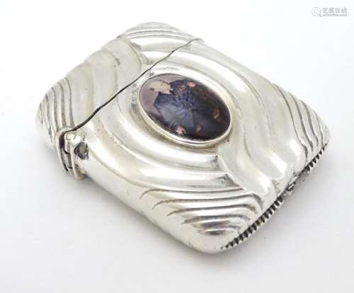 A silver vesta case converted to a lighter and with