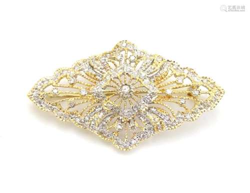 A 18ct gold brooch set with a profusion of diamonds. 1