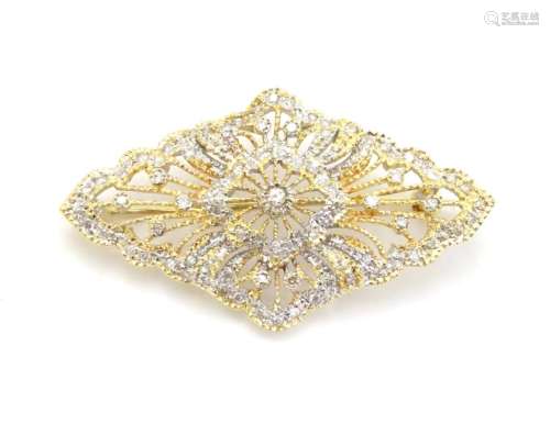 A 18ct gold brooch set with a profusion of diamonds. 1