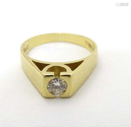 An 18ct gold diamond solitaire ring, the diamond approx