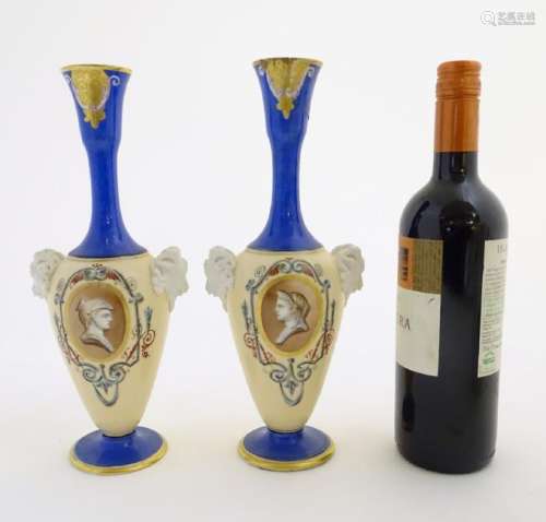 A pair of vases with hand painted Roman portraits in