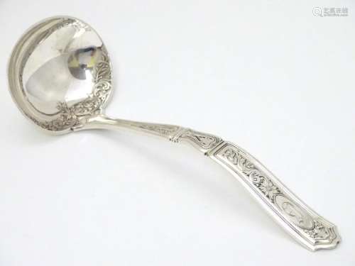 An American silver ladle, maker Gorham Manufacturing