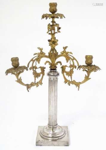 A three branch upcycled candelabra with a silver plated