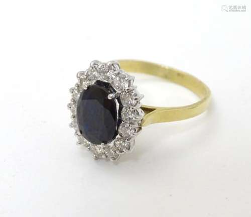 A vintage 18ct gold ring set with central sapphire