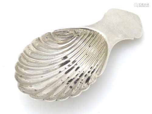 A silver caddy spoon with shell formed bowl. Hallmarked