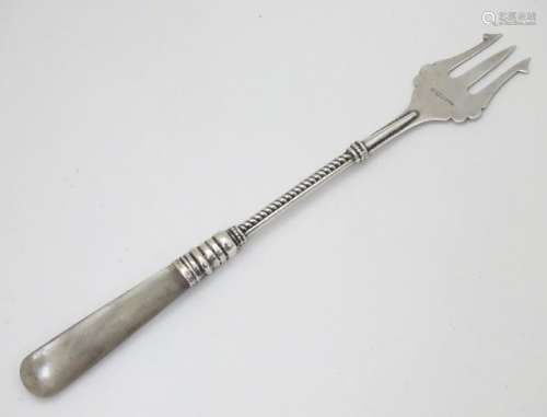 A silver pickle fork hallmarked Birmingham 1921 maker