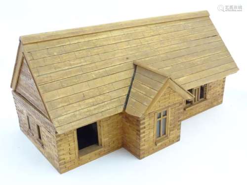 A scratch-built wooden doll's house/bungalow with a