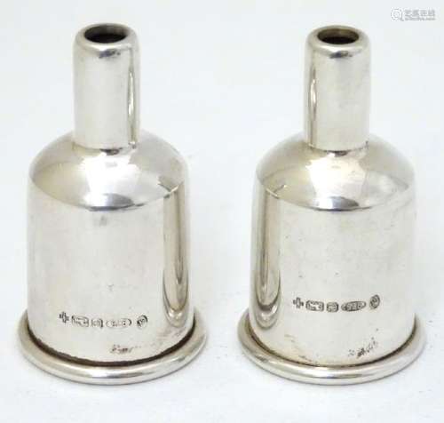 A pair of silver party popper sleeves / covers