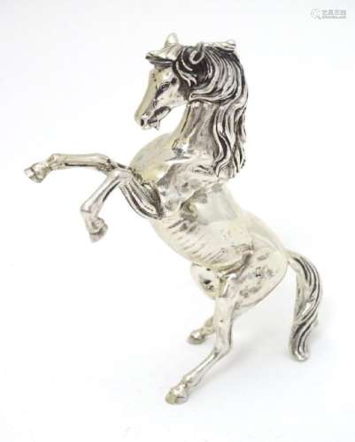 An Egyptian silver model of a horse 4'' long
