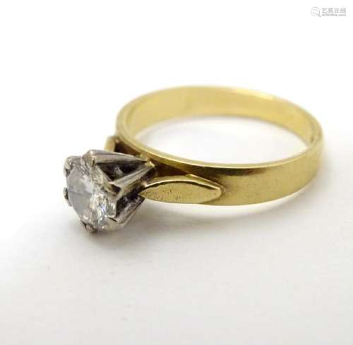 An 18ct gold diamond solitaire ring. the diamond approx