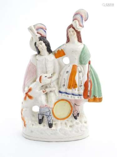 A Staffordshire pottery figural group of two figures
