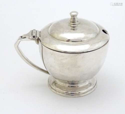 An Art Deco silver mustard pot Hallmarked London 1939