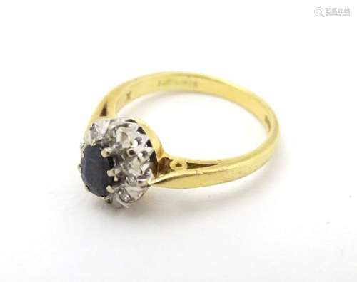 A Vintage 1970's 18ct gold ring set with central