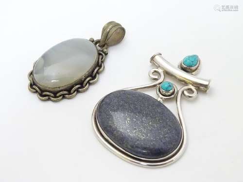 A silver pendant set with large hardstone cabochon and