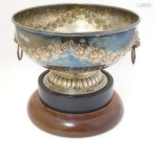 A silver plate pedestal bowl with floral swag