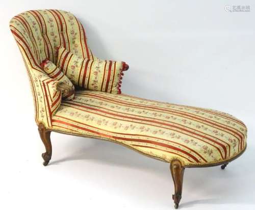 A late 19thC rosewood chaise longue, with scrolled