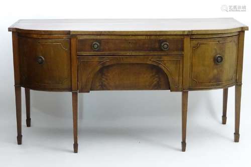 An early 20thC mahogany bow fronted sideboard, having