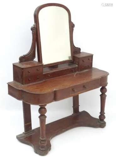 A late 19thC mahogany dressing table, with an arched