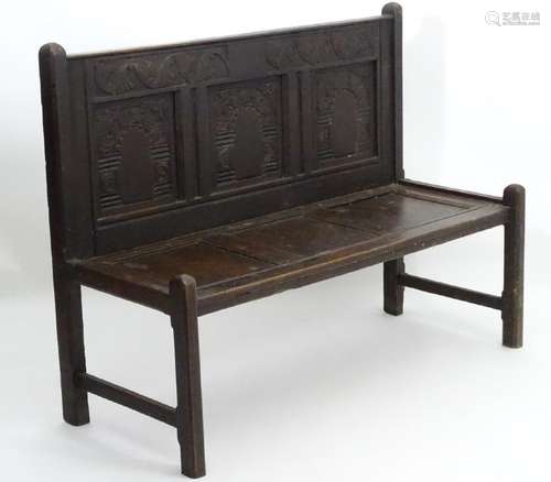 An 18thC and later oak Wainscot style bench, with