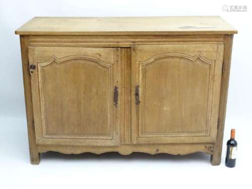 A late 19thC oak sideboard with a rectangular top above
