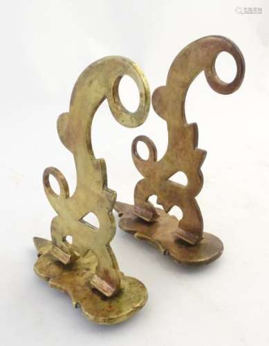 A pair of 19thC phosphor bronze wall hooks/curtain