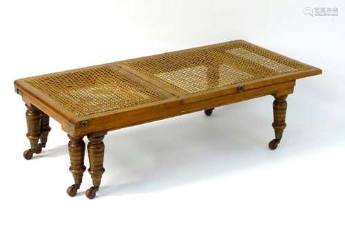 A late 19thC campaign bed, having a cane mahogany