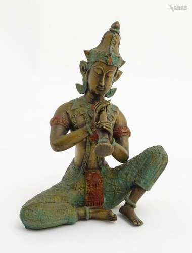 A polychromed cast bronze figure of a traditional Thai