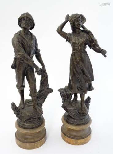 A pair of patinated Spelter figures of a Fisherman with