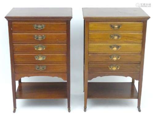 A pair of Edwardian mahogany music cabinets, each