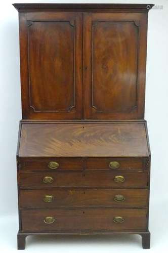 A George III mahogany bureau bookcase, with checkered