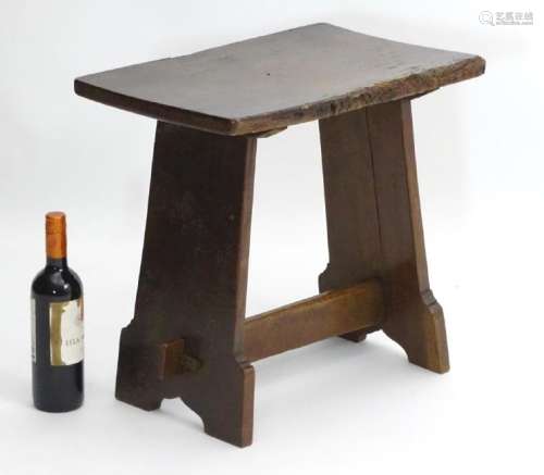A 17thC and later oak stool with rectangular top above