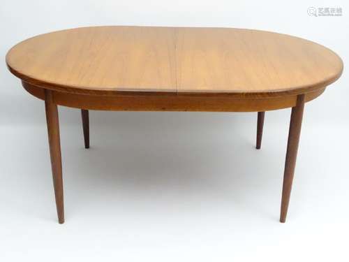 Vintage Retro : a British G-Plan ( red ) teak extending