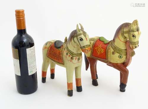 2 carved wooden and painted Indian ? tacked horses, one