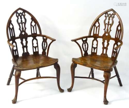 Two 18thC yew and ash Gothic Windsor chairs, with a