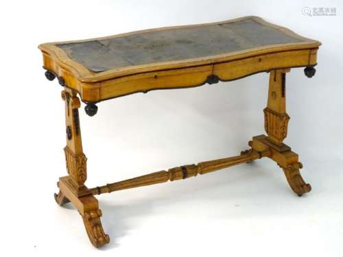 A mid 19thC birdseye maple library table with an inset