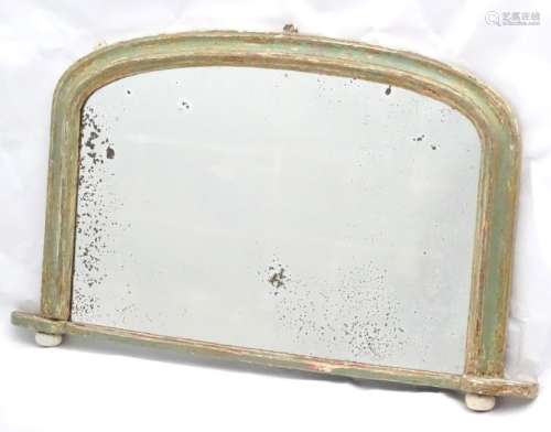 A Victorian painted over mantle mirror with a moulded