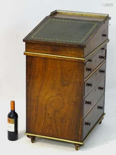 A Regency rosewood Davenport with brass gallery and