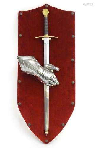 A 20thC wall display of medieval style knights' arms &