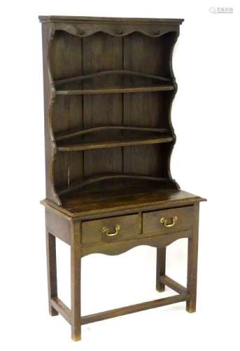 An early 20thC oak dresser of small proportions, having