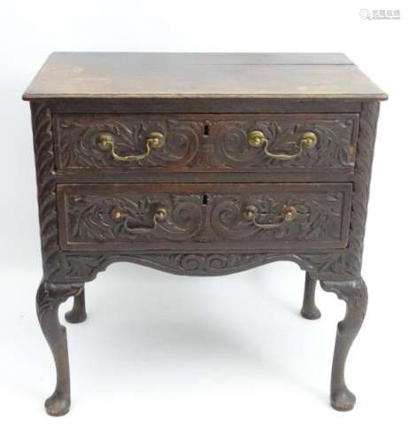 An early 18thC oak lowboy, with later Victorian carving