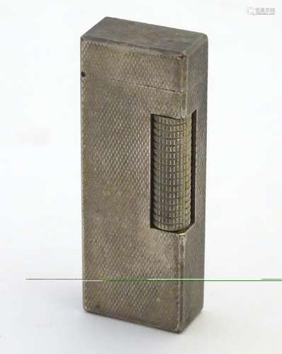 A 1971-model silver plated Dunhill 'Rollagas' lighter,