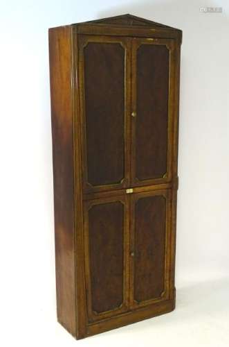 A mid 19thC mahogany ships cabinet with a pointed