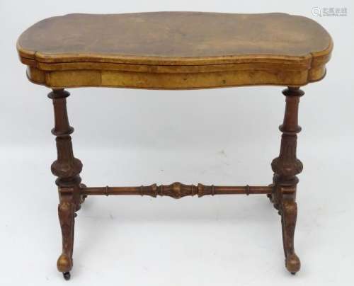 A late 19thC walnut card table, having a shaped burr