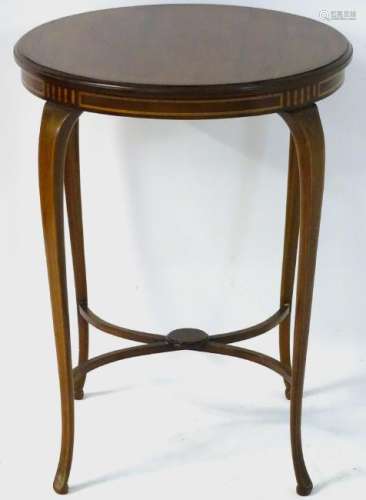 An early 20thC Sheraton revival occasional table with a