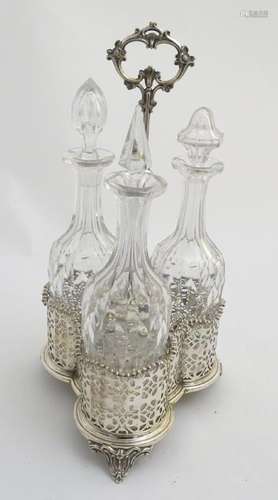 A 19thC silver plate three decanter set and stand, with