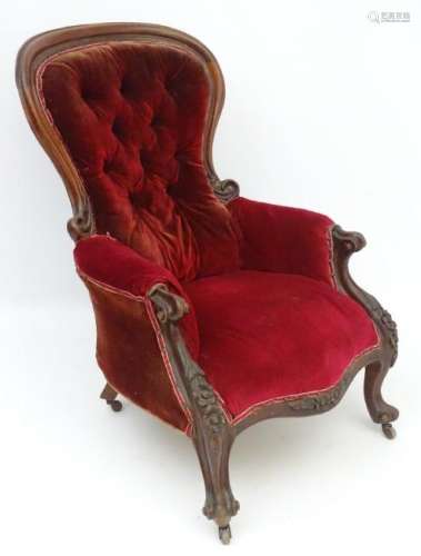 A Victorian mahogany lounge chair with button back