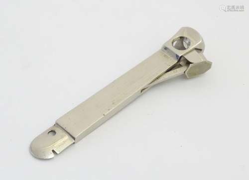 A 20thC stainless steel cigar cutter, the sprung blade