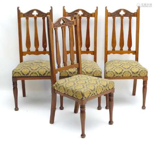 A set of four early 20thC Art Nouveau walnut dining
