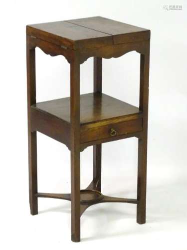 A Georgian mahogany night stand, with a folding top